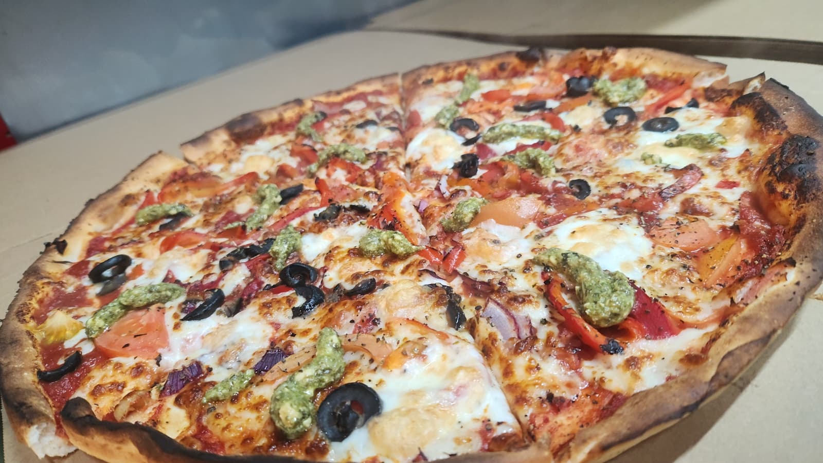 Urban Pizza with vegetables, olives and pesto